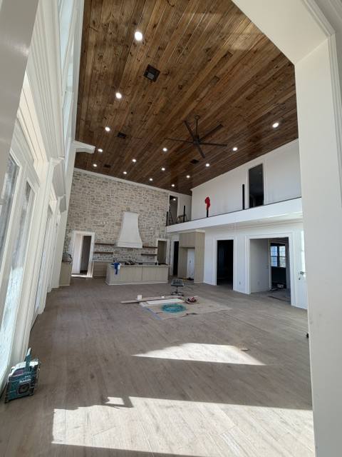 Vaulted wood plank ceiling great room under construction